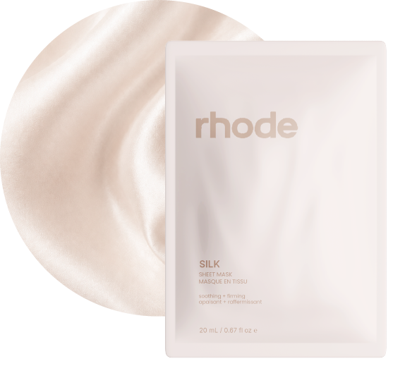 Silk sheet-mask packaging layered over cream silk fabric