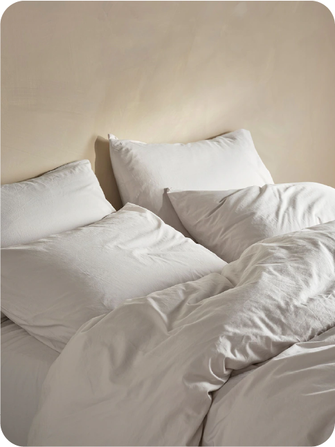 Soft white bedding used as a tactile photo moment